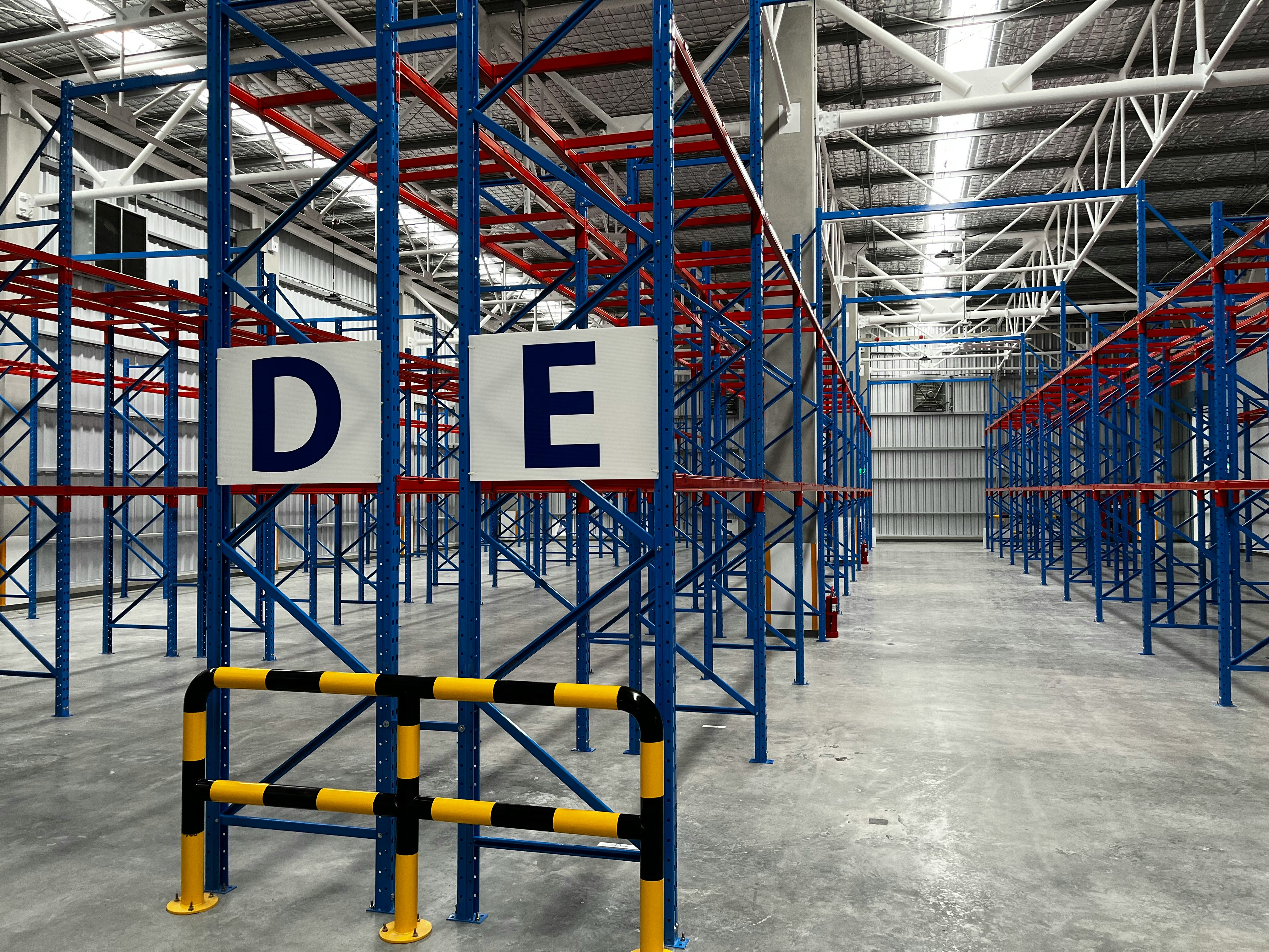 Large warehouse with tall pallet racking systems